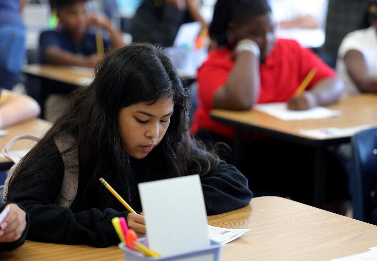 Students sit in pairs while during a sixth grade science class at William Monnig Middle School on Friday, Aug. 14, 2026, in Fort Worth. The school is part of the Elevate Network.